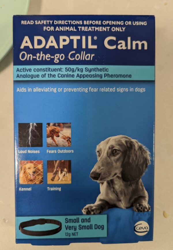 Adaptil Calm Collar Box sitting on bench. Plate visible in background